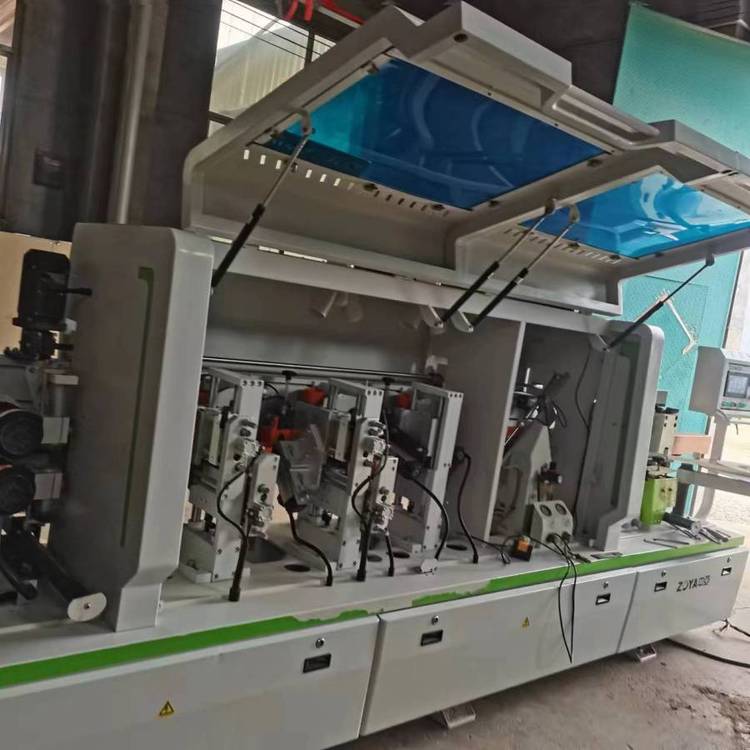 出售中亞全自動(dòng)封邊機(jī)板式櫥柜門板全屋定制回收二手木工機(jī)械設(shè)備