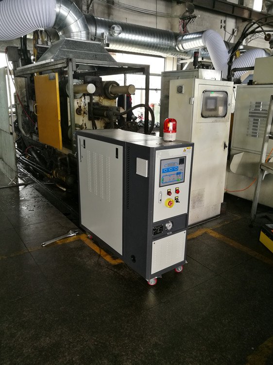 汽車內(nèi)飾件熱壓成型控溫用油式模溫機電導(dǎo)熱油爐廠家
