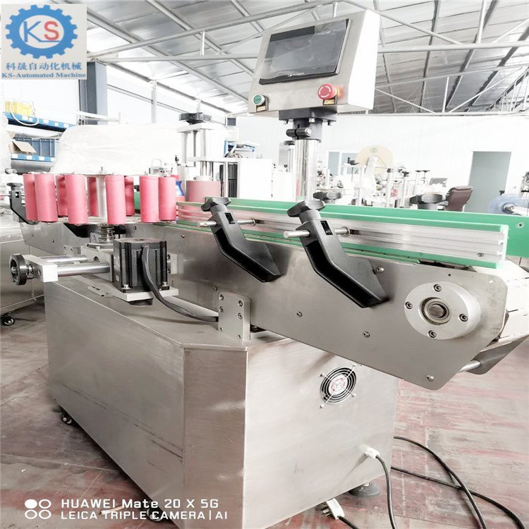 二手圓瓶酒精噴霧劑貼標(biāo)機(jī)不干膠圓瓶貼標(biāo)機(jī)自動分瓶貼標(biāo)機(jī)處理